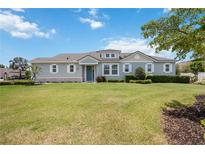 Charming single-story home featuring a well-manicured lawn, beautiful landscaping, and impeccable curb appeal at 3664 Tin Cup Blvd, Sarasota, FL 34232