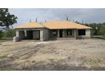 A new construction home with block and partial roof, awaiting customization at 7 Pine Valley Ct, Rotonda West, FL 33947
