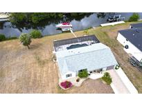 Stunning waterfront home featuring a screened pool, boat dock and a well maintained yard in a desirable location at 18954 Ayrshire Cir, Port Charlotte, FL 33948