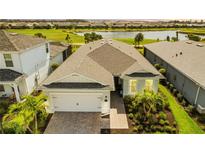 Stunning aerial view of a well-kept home with a lush green lawn, picturesque landscaping and charming neighborhood views at 15830 Appalachian Dr, Punta Gorda, FL 33982