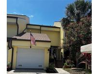 Charming townhome featuring an attached garage and inviting front porch at 25188 Marion Ave # 1004, Punta Gorda, FL 33950