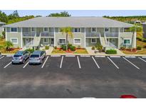 Charming condominium building with well maintained landscaping and ample parking spaces at 3310 Loveland Blvd # 1503, Punta Gorda, FL 33980