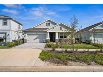 Charming single-story home featuring a well-manicured lawn and inviting front porch at 16029 Mulrion Blvd, Punta Gorda, FL 33982