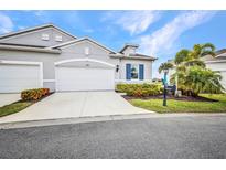 Charming one-story home with a two-car garage, well-manicured landscaping, and a freshly sealed driveway at 1678 Royal Ct, Punta Gorda, FL 33980