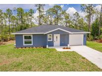 Charming single-Gathering home with a well-maintained lawn and a concrete driveway at 28218 N Twin Lakes Dr, Punta Gorda, FL 33955