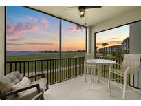 Enjoy the lovely screened patio featuring comfortable seating and serene golf course and sunset views at 43030 Greenway Blvd # 426, Punta Gorda, FL 33982