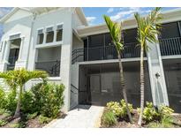A charming two-story home with tropical landscaping at 43984 Boardwalk Loop # 1726, Punta Gorda, FL 33982