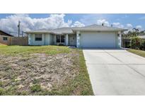 Charming single-story home with a well-manicured lawn and a two-car garage at 5331 Citadel Rd, Venice, FL 34293