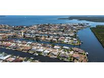 Expansive aerial view of waterfront homes on canals, boasting beautiful waterways and desirable neighborhood at 110 Colonial Sw St, Port Charlotte, FL 33952