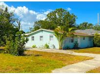 Charming single-story home featuring a well-maintained lawn, mature trees, and a welcoming exterior at 514 Showalter Ave, Punta Gorda, FL 33950