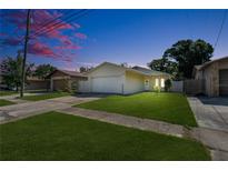 Charming single-story home with a well-maintained lawn and a two-car garage at 6841 46Th N St, Pinellas Park, FL 33781