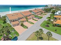 Beautiful beachfront condos with tile roofs and private garages offer stunning ocean views and lush landscaping at 876 Golden Beach Blvd # 876, Venice, FL 34285
