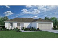 Charming single-story home featuring a two-car garage, well-manicured lawn, and inviting front garden at 3829 Caesar Rd, North Port, FL 34288