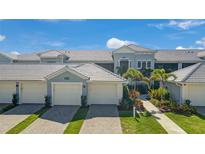 Beautiful exterior elevation of home featuring lush landscaping and attached garage at 14267 Heritage Landing Blvd # 1223, Punta Gorda, FL 33955