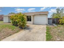 Charming single-story home features a two-car garage and well-maintained lawn at 4282 Pocatella Ave, North Port, FL 34287