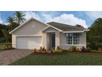 Charming single-story home with a two-car garage, manicured lawn, and beautiful landscaping at 9474 Turtle Grass Cir, Punta Gorda, FL 33950