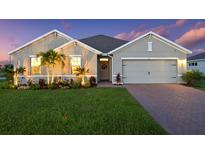 Charming single-story home with well-manicured lawn and a two-car garage at 16032 Galiano Ct, Punta Gorda, FL 33955