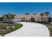 Charming single-story home boasting a well-maintained lawn, inviting entrance, and a convenient two-car garage at 259 Fields Ter, Port Charlotte, FL 33952