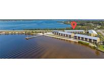 Waterfront condos with a pier, beach, and pool provide the ultimate coastal lifestyle at 14459 River Beach Dr # 112, Port Charlotte, FL 33953