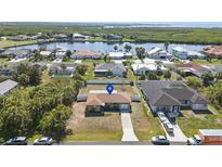 Beautiful waterfront property with lush landscaping and stunning water views at 4358 Pates St, Port Charlotte, FL 33948