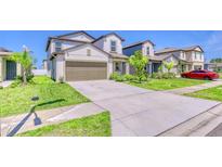 Charming two-story home with a two-car garage, well-maintained lawn, and inviting curb appeal at 111 Rain Lily Ave, Spring Hill, FL 34609