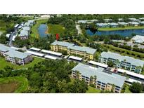 Beautiful aerial view of condo community surrounded by lush landscaping and tranquil ponds at 2060 Willow Hammock Cir # 301, Punta Gorda, FL 33983