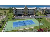 Enjoy an active lifestyle with this community tennis court by manicured landscaping and building views at 101 N Marion Ct # 133, Punta Gorda, FL 33950