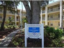 Exterior of a condo with balconies and sign reading 433 Cerromar Lane, with building number 24 at 433 Cerromar Ln # 541, Venice, FL 34293