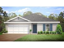 Charming single-story home featuring a manicured lawn, a blue front door, and a two car garage at 18139 Regan Ave, Port Charlotte, FL 33948