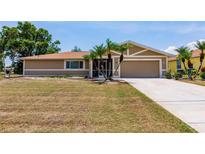 Charming single-story home featuring well-maintained landscaping and a two-car garage at 2365 Nuremberg Blvd, Punta Gorda, FL 33983
