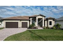 Beautiful single-story home with a two-car garage, tile roof and well-manicured lawn at 4426 Vasco St, Punta Gorda, FL 33950