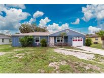 Charming single-story home with a well-maintained front yard and a one-car garage at 4583 S Salford Blvd, North Port, FL 34287