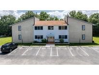 Charming condo building exterior features a well-maintained facade and ample parking spaces at 22481 Westchester Blvd # B48, Punta Gorda, FL 33980