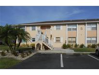 Charming multi-Gathering home featuring a neatly landscaped yard and designated guest parking spaces at 25050 Sandhill Blvd # A2, Punta Gorda, FL 33983