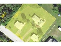 Aerial view of property boundaries, outlining the home and surrounding land at 28024 Cleveland Ave, Punta Gorda, FL 33982