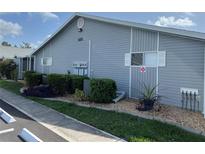 Charming condo featuring a well-maintained exterior with manicured landscaping and neutral-colored siding at 3300 Loveland Blvd # 602, Punta Gorda, FL 33980