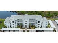 Beautiful condo complex with modern architecture, lush landscaping, and convenient parking at 14141 Heritage Landing Blvd # 912, Punta Gorda, FL 33955