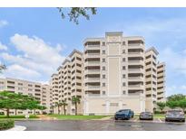 Luxury condo building with multiple stories, balconies, and well-maintained landscaping at 3730 Cadbury Cir # 616, Venice, FL 34293