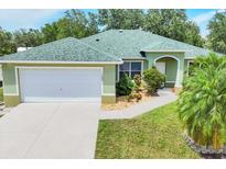 Charming one-story home with a well-manicured lawn and lush landscaping in a peaceful neighborhood at 7280 Muncey Rd, North Port, FL 34291