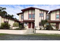 Charming two-story townhome with well-maintained landscaping and neutral exterior at 93 Boundary Blvd # 303, Rotonda West, FL 33947