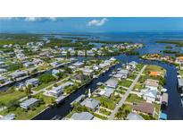 Waterfront home featuring direct access to the Gulf with dock and lift, perfect for boating enthusiasts at 24261 Captain Kidd Blvd, Punta Gorda, FL 33955