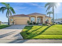 Beautiful single-story home with a tile roof, well-kept lawn, and tasteful landscaping at 3322 Sandpiper Dr, Punta Gorda, FL 33950