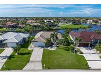 Expansive aerial view of waterfront homes with lush landscaping and private docks at 531 Madrid Blvd, Punta Gorda, FL 33950