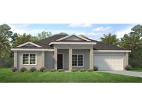Charming single-story home features a two-car garage and well-maintained landscaping at 2308 Oberon Ln, Punta Gorda, FL 33983