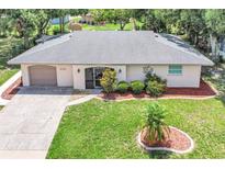 Charming single-story home with a well-manicured lawn and inviting curb appeal at 2131 Amanda Dr, Sarasota, FL 34232