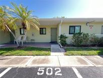 Inviting exterior showcasing the building's facade, landscaping, and unit numbers for easy identification at 25225 Rampart Blvd # 502, Punta Gorda, FL 33983