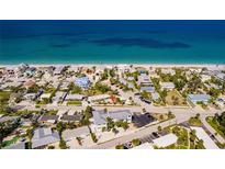 Aerial view of beachside homes and turquoise water at 1285 Gulf Blvd # 7, Englewood, FL 34223