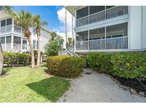 Two-story building with screened balconies at 7446 Palm Island Dr # 3514, Placida, FL 33946