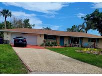 Charming single-story home with a spacious yard at 745 Coral Way, Englewood, FL 34223