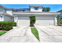 Two-car garage with attached driveway at 3322 Grand Vista Ct # 203, Port Charlotte, FL 33953